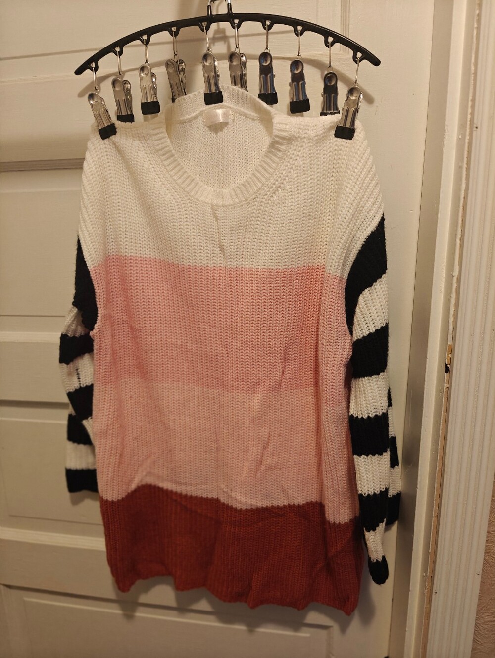 The Sweet Light Sweater for women in size M features a colorful striped pattern,